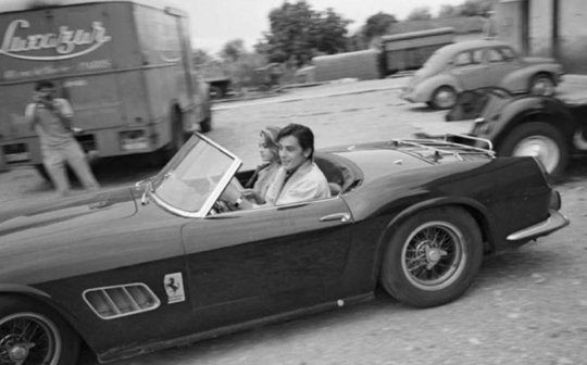Alain Delon in the company of the Fund Jen on his Ferrari 250 GT California Spider